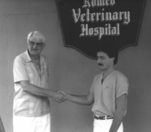 Dr. Michael Schumacher shaking hands with a client